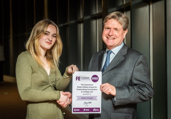 Molly Mudie receiving her Further Education award certificate from Andrew Barnes, Chair of Governors, City College Norwich (Pic - David Kirkham)
