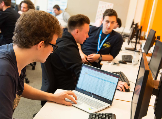 Students studying in computing and information technology class