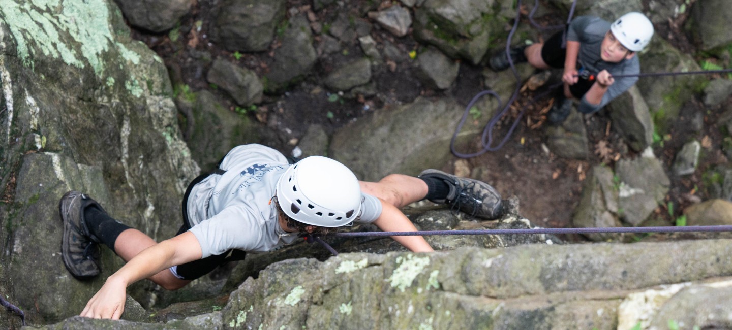 Young people rock climbing