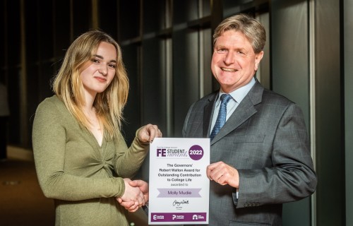 Molly Mudie receiving her Further Education award certificate from Andrew Barnes Chair of Governors City College Norwich CREDIT DAVID KIRKHAM 1 v2