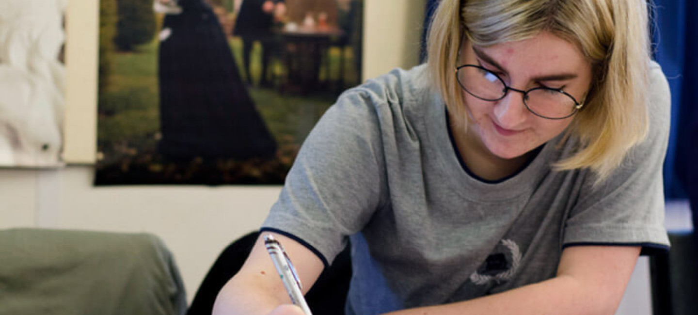 Student studying humanities with open textbook