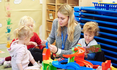 Student on placement in nursery school with children