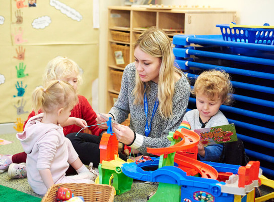 Student on placement in nursery school with children